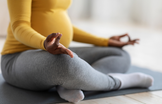 Pregnant woman practicing yoga