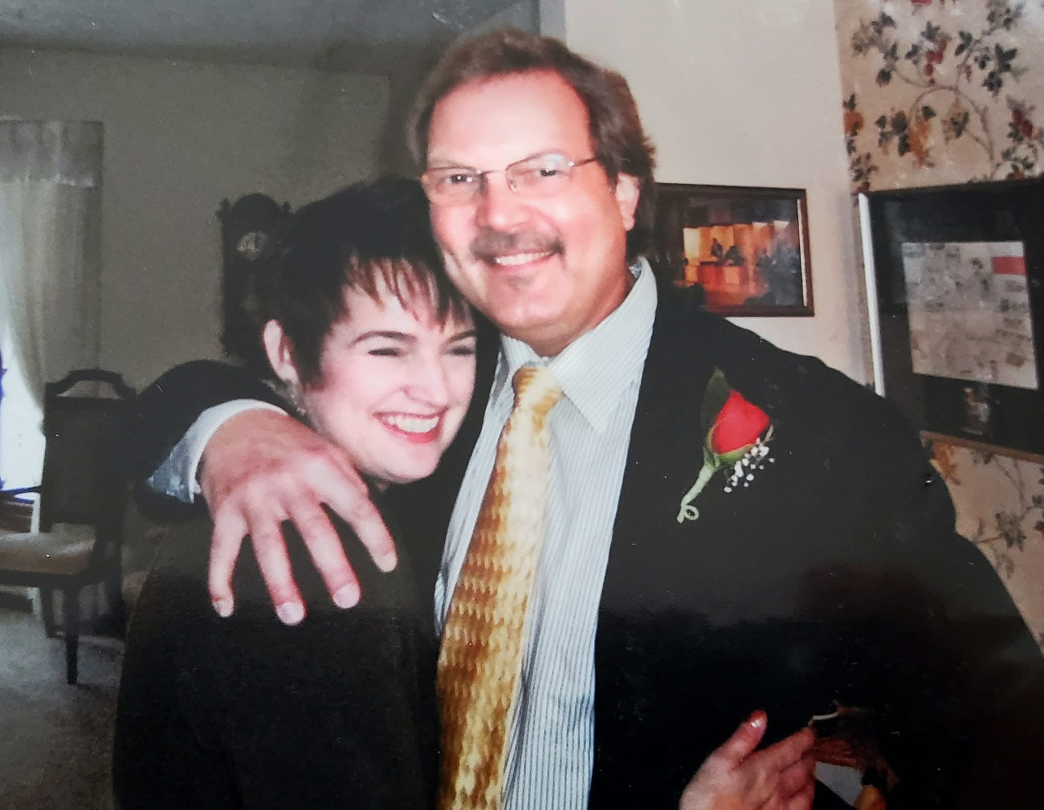 Al, in his younger years hugging his wife in their home