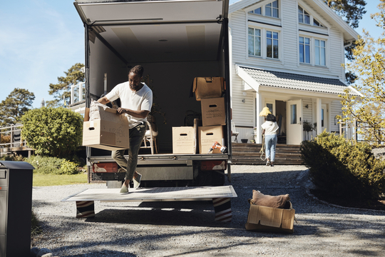 Young couple moving into a new home
