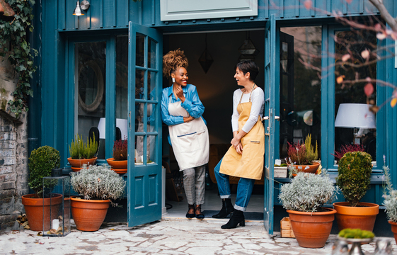 two female business owners outside shop