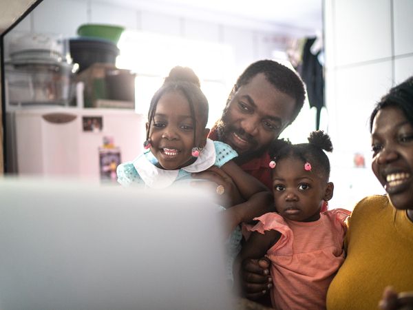 family looking at computer