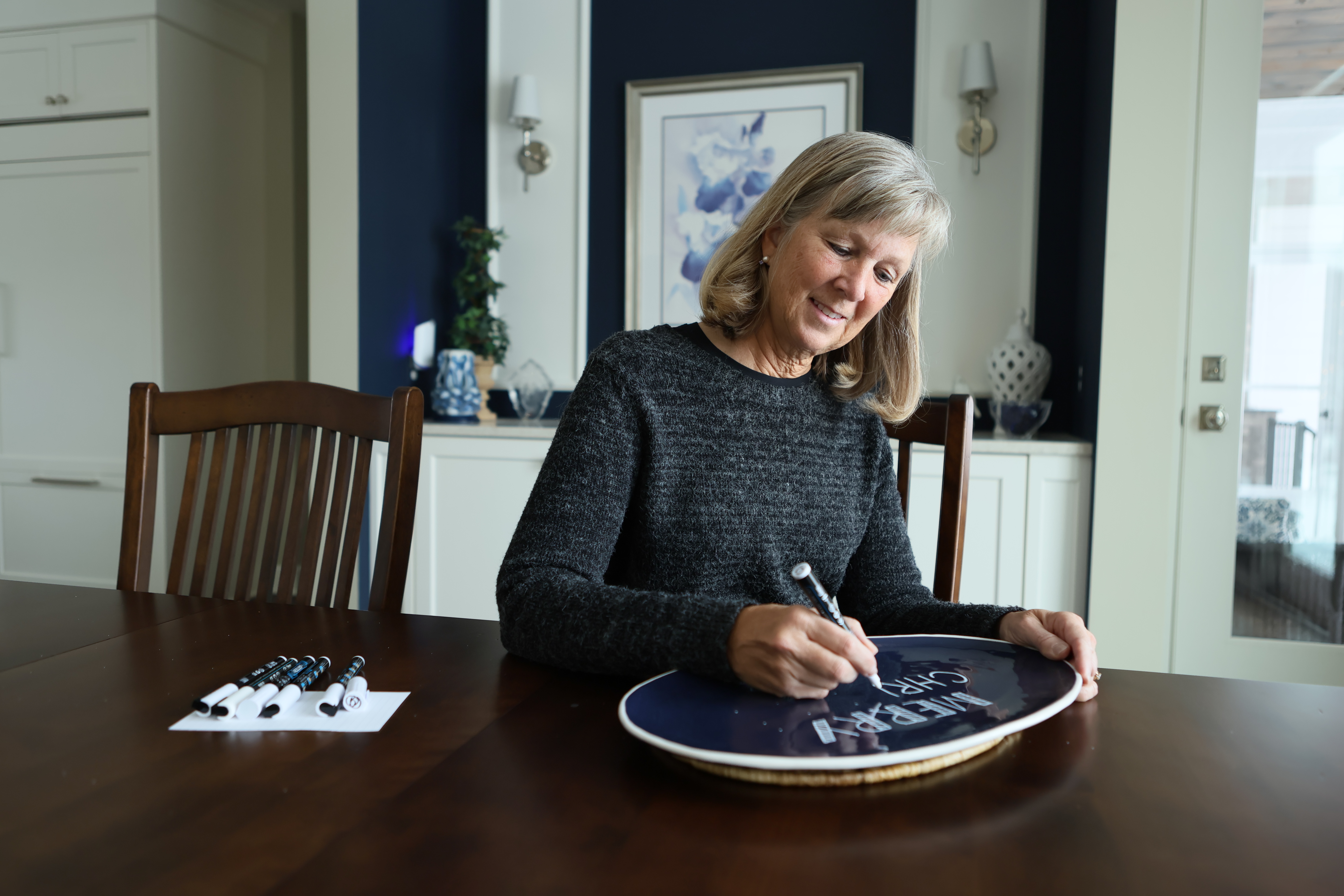 Karen making holiday crafts at her kitchen table