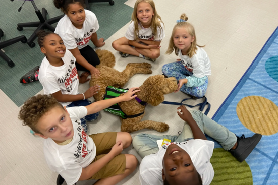 Priority Pups emotional support dog Scout visiting elementary students in Muskegon Heights Michigan